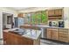 Modern kitchen with stainless steel appliances, a granite countertop, and plenty of natural light at 440 W Marion St, Danville, IN 46122