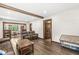 Spacious living room with wood flooring, open layout, wood beams, and an adjacent dining area at 440 W Marion St, Danville, IN 46122