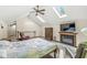 Cozy main bedroom featuring a fireplace, vaulted ceiling, and ample natural light at 440 W Marion St, Danville, IN 46122