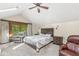 Sunlit bedroom with a skylight, balcony access, and a comfortable seating area at 440 W Marion St, Danville, IN 46122