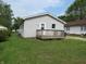 Charming home with light siding and a quaint porch, surrounded by a lush green lawn at 470 N Pine St, Morgantown, IN 46160