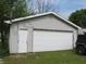 Spacious detached garage with a large white door and a convenient side entrance at 470 N Pine St, Morgantown, IN 46160
