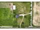 Birds eye view of an estate featuring a charming home, barn, large lawn, and private driveway at 4749 Maple Grove Rd, Martinsville, IN 46151