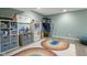 Finished basement playroom with a basketball hoop, storage, and a comfortable play area at 4749 Maple Grove Rd, Martinsville, IN 46151