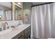 The bathroom offers a double vanity with stone countertop and updated fixtures at 4749 Maple Grove Rd, Martinsville, IN 46151