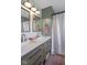 Bathroom featuring double vanity, framed mirrors, and a white shower curtain at 4749 Maple Grove Rd, Martinsville, IN 46151