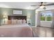 Relaxing bedroom with a ceiling fan, a serene color scheme, and bright, natural light at 4749 Maple Grove Rd, Martinsville, IN 46151