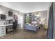 Well-lit bedroom with a desk, decorated shelving, and a comfortable bed at 4749 Maple Grove Rd, Martinsville, IN 46151