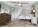 Well-lit bedroom with ceiling fan, walk-in closet, and private bathroom access at 4749 Maple Grove Rd, Martinsville, IN 46151