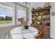 Inviting breakfast nook featuring natural light and wooden hutch with decorative items at 4749 Maple Grove Rd, Martinsville, IN 46151