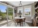 Cozy breakfast nook with table and chairs, bright windows, and slider access to the deck at 4749 Maple Grove Rd, Martinsville, IN 46151