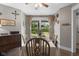 Charming dining area featuring wood floors, a window, and unique decor at 4749 Maple Grove Rd, Martinsville, IN 46151