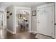 Warm and inviting entryway featuring wood floors and a view into the dining room at 4749 Maple Grove Rd, Martinsville, IN 46151