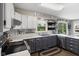 A view of the kitchen showcasing the two-tone cabinets and stainless steel appliances at 4749 Maple Grove Rd, Martinsville, IN 46151
