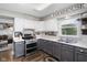 Charming kitchen features two-tone cabinets, modern appliances, and a farmhouse-style decor at 4749 Maple Grove Rd, Martinsville, IN 46151