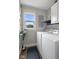 Well-lit laundry room with a window, washer, dryer, and room for cleaning supplies at 4749 Maple Grove Rd, Martinsville, IN 46151