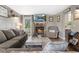 Inviting living room featuring a brick fireplace and views out to the backyard at 4749 Maple Grove Rd, Martinsville, IN 46151