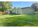 Spacious backyard features a well-maintained lawn and an above ground pool at 48 W Adams Brick Ave, Martinsville, IN 46151