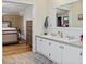 Bright bathroom with a double sink vanity and a view into the primary bedroom at 48 W Adams Brick Ave, Martinsville, IN 46151