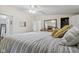 Inviting bedroom featuring wood-look flooring, a king bed, a walk-in closet, and soothing neutral colors at 48 W Adams Brick Ave, Martinsville, IN 46151