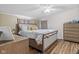 Comfortable bedroom with wood-look flooring, a queen bed, neutral colored walls, and lots of storage at 48 W Adams Brick Ave, Martinsville, IN 46151