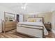Cozy bedroom with a king bed, wood-look flooring, a walk-in closet, and neutral decor at 48 W Adams Brick Ave, Martinsville, IN 46151