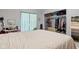 Bedroom featuring a large bed, closet with clothing and wood look flooring at 48 W Adams Brick Ave, Martinsville, IN 46151