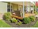 Welcoming front porch with seating, plants, and inviting decor at 48 W Adams Brick Ave, Martinsville, IN 46151
