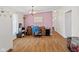 Bright office space with wood-look flooring, a vintage wooden desk, and plenty of room for storage at 48 W Adams Brick Ave, Martinsville, IN 46151
