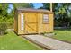 Wooden shed with a 'Welcome' sign and decorative stone path at 48 W Adams Brick Ave, Martinsville, IN 46151