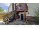 Backyard of the home with stairs leading to the second story patio and walkout basement at 492 Pelenor Dr, Franklin, IN 46131