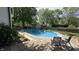 Backyard pool with a diving board and room for entertaining at 492 Pelenor Dr, Franklin, IN 46131
