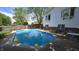A large in-ground pool highlights this large manicured backyard at 492 Pelenor Dr, Franklin, IN 46131