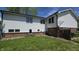 Spacious backyard of the home with a partial view of the brick foundation at 492 Pelenor Dr, Franklin, IN 46131