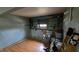 Unfinished basement with hardwood style flooring, toys, and a window at 492 Pelenor Dr, Franklin, IN 46131