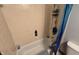This tiled bathroom features a tub with shower and a curved shower curtain rod at 492 Pelenor Dr, Franklin, IN 46131