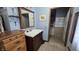 Bathroom with a wood vanity, framed mirror, and access to the toilet and shower area at 492 Pelenor Dr, Franklin, IN 46131
