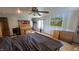 A bedroom featuring wood furniture, blue and white striped walls, and a charming ceiling fan at 492 Pelenor Dr, Franklin, IN 46131