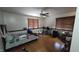 Cozy bedroom has hardwood floors, a ceiling fan, and ample natural light from two windows at 492 Pelenor Dr, Franklin, IN 46131