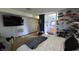 Comfortable bedroom has carpet, TV, lots of shelves, and adjoins a bathroom at 492 Pelenor Dr, Franklin, IN 46131