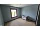 Bedroom view with natural light, neutral paint and an empty crib at 492 Pelenor Dr, Franklin, IN 46131