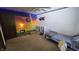 Another bedroom view with whimsical art, ceiling fan and a comfy single bed at 492 Pelenor Dr, Franklin, IN 46131