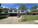 Charming split-level home featuring a well-manicured lawn and an attached two-car garage at 492 Pelenor Dr, Franklin, IN 46131