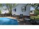 Backyard view of this home with an in-ground pool and patio area at 492 Pelenor Dr, Franklin, IN 46131