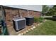 Two air conditioning units sit outside of the home in this well landscaped yard at 492 Pelenor Dr, Franklin, IN 46131