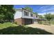 Charming two-story home with a well-manicured lawn, mature trees and black garage door at 492 Pelenor Dr, Franklin, IN 46131