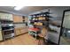 Charming kitchen featuring wood cabinets, stainless steel appliances, and open shelving for storage at 492 Pelenor Dr, Franklin, IN 46131
