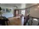 Open loft-style area with a unique table, piano, and plenty of natural light from the windows at 492 Pelenor Dr, Franklin, IN 46131