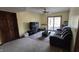 Cozy living room featuring a sliding door to the outside and comfortable carpeted floors at 492 Pelenor Dr, Franklin, IN 46131
