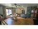 Bright and airy living space with hardwood floors, ceiling fans, and cozy table at 492 Pelenor Dr, Franklin, IN 46131